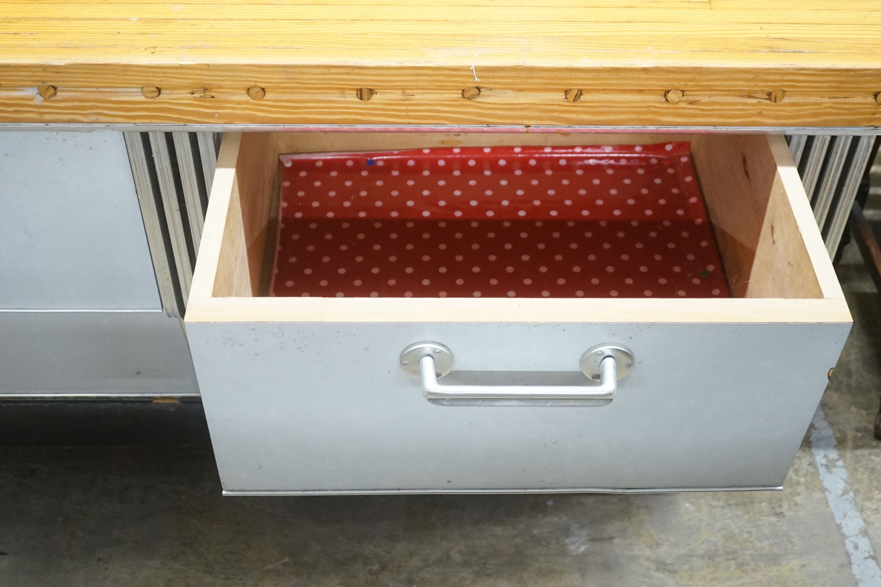 A mid 20th century shop counter cabinet with pine strip work top, width 152cm depth 71cm height 88cm